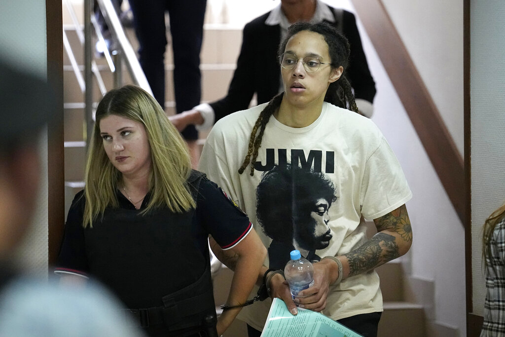 WNBA star and two-time Olympic gold medalist Brittney Griner is escorted to a courtroom for a hearing, in Khimki just outside Moscow, Russia, Friday, July 1, 2022. U.S. basketball star Brittney Griner is set to go on trial in a Moscow-area court Friday. The proceedings that are scheduled to begin Friday come about 4 1/2 months after she was arrested on cannabis possession charges at an airport while traveling to play for a Russian team.