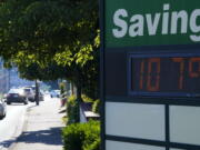 A display at an Olympia Federal Savings branch shows a temperature of 107 degrees Fahrenheit, Monday, June 28, 2021, in the early evening in Olympia, Wash. (AP Photo/Ted S.