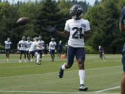 Seattle Seahawks cornerback Artie Burns runs a drill during NFL football practice Monday, Aug. 1, 2022, in Renton, Wash. (AP Photo/Ted S.