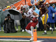 Washington State wide receiver Lincoln Victor (85) celebrates after scoring a touchdown against Central Michigan during the second half of the Sun Bowl NCAA college football game in El Paso, Texas, Friday, Dec. 31, 2021.