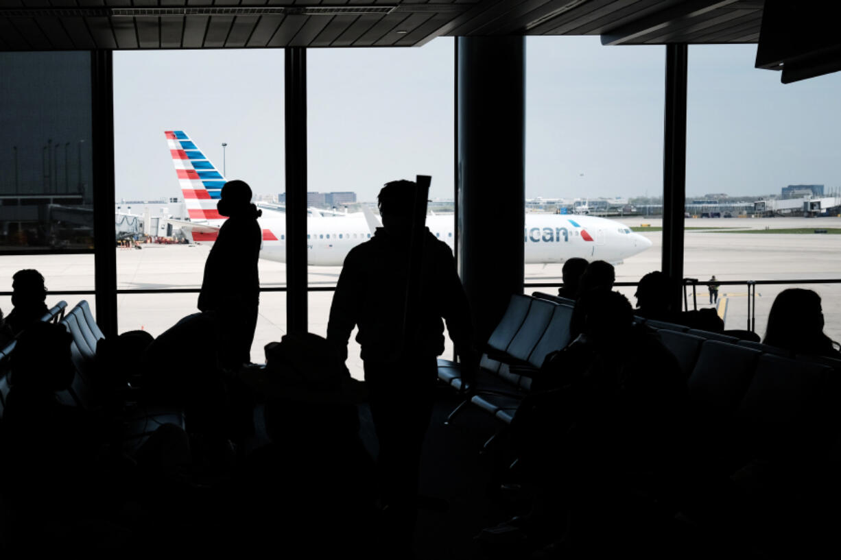 People walk through LaGuardia Airport on April 26, 2021 in New York City. The newly renovated LaGuardia saw almost three times as many cancellations as the national average, with 7.7% of flights canceled this summer.