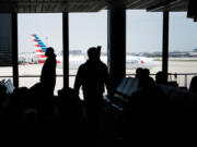 People walk through LaGuardia Airport on April 26, 2021 in New York City. The newly renovated LaGuardia saw almost three times as many cancellations as the national average, with 7.7% of flights canceled this summer.