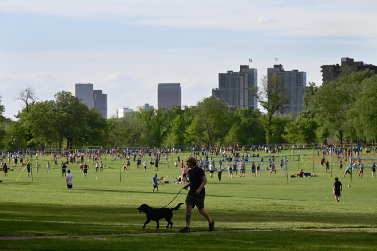 In this photo from May 19, 2022, people enjoy outdoor activities at Washington Park in Denver.