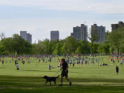 In this photo from May 19, 2022, people enjoy outdoor activities at Washington Park in Denver.