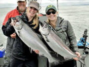 Lucienne de Boer (left) and Melissa Peterson with Buoy 10 Chinook they caught recently while fishing with guide Bob Rees. Chinook fishing was too good this year, and the states were forced to close the fishery for Chinook. Coho remains open.