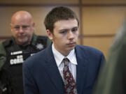 Brent Luyster Jr. makes his way into the courtroom for opening statements in his second-degree murder trial Tuesday at the Clark County Courthouse. Luyster Jr., who is the son of convicted triple murderer Brent Luyster, is accused of fatally stabbing his stepfather in May 2021 at an Amboy apartment.