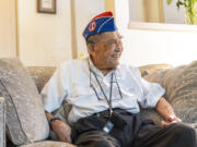 Vancouver resident Yoshiro "Yosh" Tokiwa served in the U.S. Army's 442nd Regimental Combat Team in World War II. At age 97, Tokiwa is still able to carry the 442nd's banner -- figuratively speaking -- in events around the region. At top, at his east Vancouver apartment, Tokiwa displays his copy of the Congressional Gold Medal honoring the U.S. Army's 442nd Regimental Combat Team.