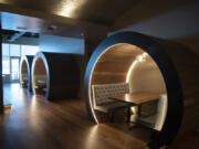 Illuminated barrel booths are among the seating options at the new Willamette Valley Vineyards restaurant at The Waterfront Vancouver.