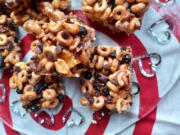 The secret is in the sticky sauce of these no-bake cereal bars: vanilla, almond extract and cinnamon are mixed in to the butter-and-marshmallow coating.