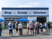 People wait in line for the grand reopening of the Clark County Habitat for Humanity Store in east Vancouver. The store offers a variety of home improvement and decor, plus furniture. Proceeds go to affordable housing programs.