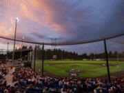 The sun sets over the Ridgefield Outdoor Recreation Complex on Tuesday, Aug. 9, 2022, during a playoff game between the Ridgefield Raptors and the Portland Pickles.