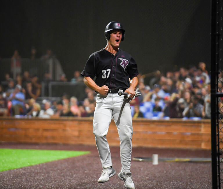 Raptors batter Riley McCarthy celebrates after scoring a run Tuesday, Aug. 9, 2022, during the Raptors’ 9-8 win against the Portland Pickles in Game 1 of the WCL playoffs at the Ridgefield Outdoor Recreation Complex.