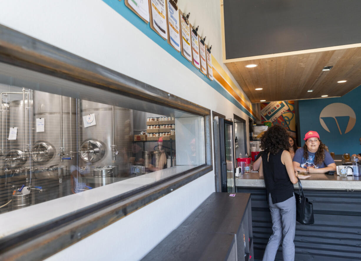 Refrigerated fermentation tanks are visible from Vice Beer's taproom. Some of the tanks are directly connected to tap handles, a rarity in breweries.