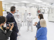 U.S. Sens. Maria Cantwell and Patty Murray talk with nLight employees with CEO Scott Keeney, left, on Wednesday in a clean room at nLight in Camas. Senators Cantwell and Murray were in town to tout the major opportunities coming to Southwest Washington in the recently passed $250 billion CHIPS and Science Act.