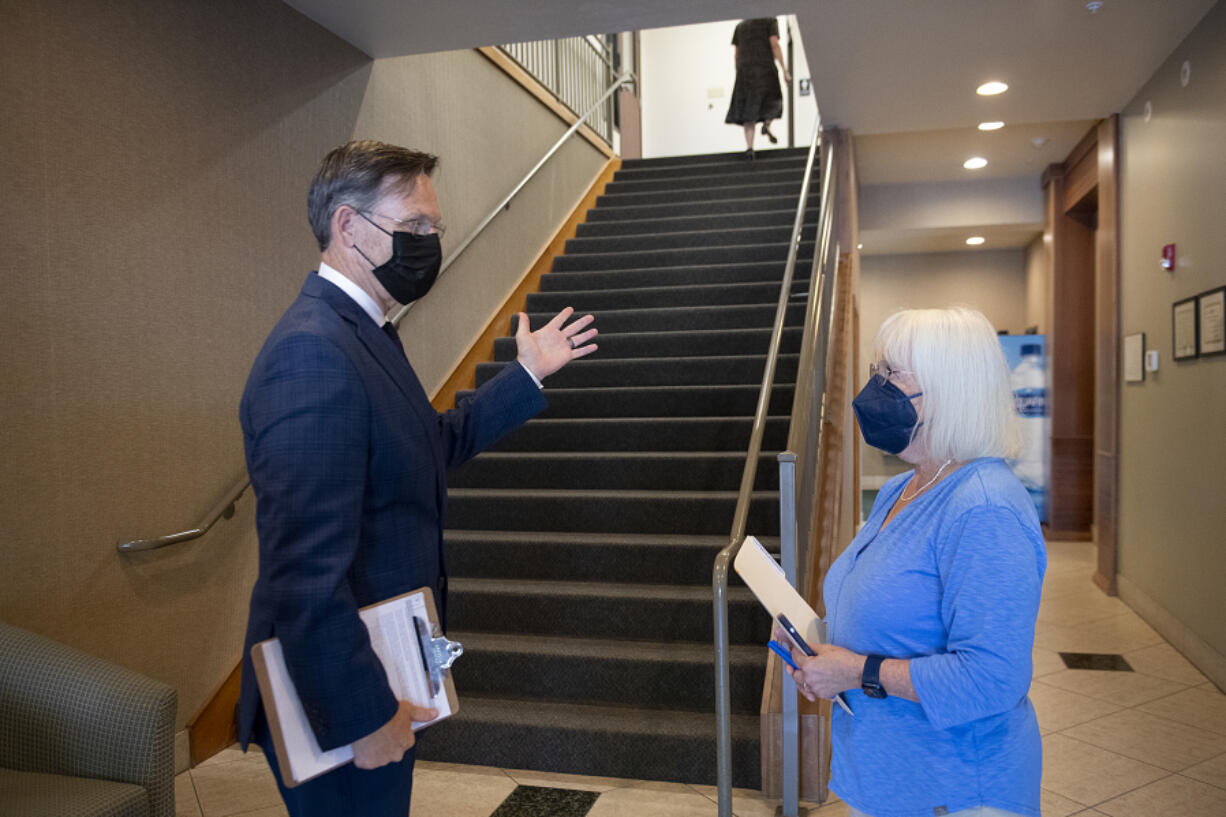 Mike Reardon, executive director of Area Agency on Aging and Disabilities of Southwest Washington, left, welcomes U.S. Sen. Patty Murray before giving her a tour of the facility Wednesday morning. Sen. Murray spoke with local leaders and health care advocates about how the Inflation Reduction Act will allow Medicare to negotiate lower prescription drug costs.