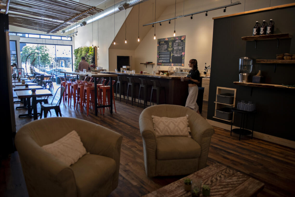 Tsea Nava, kava tender at Bula Kava House, works behind the scenes in downtown Vancouver on Tuesday morning. The kava bar had its' soft opening Aug. 9, marking Vancouver's first kava bar.