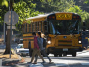 Discovery Middle School students keep in step as they head to class on Tuesday morning.