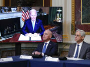 Homeland Security Secretary Alejandro Mayorkas and Attorney General Merrick Garland, right, listen as President Joe Biden speaks virtually during the first meeting of the interagency Task Force on Reproductive Healthcare Access in the Indian Treaty Room in the Eisenhower Executive Office Building on the White House Campus in Washington, Wednesday, Aug. 3, 2022.