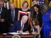 President Joe Biden signs the "PACT Act of 2022" during a ceremony in the East Room of the White House, Wednesday, Aug. 10, 2022, in Washington.