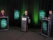 Washington Secretary of State Steve Hobbs, right, a Democrat, and Pierce County Auditor Julie Anderson, left, running as a nonpartisan, take part in a debate, Wednesday, Aug. 17, 2022, in Olympia, Wash., with Melissa Santos, center, of Axios Local, moderating. Hobbs and Anderson are seeking to fill the remaining two years of the term of Republican Secretary of State Kim Wyman, who left to take a key election security job in the Biden administration. (AP Photo/Ted S.