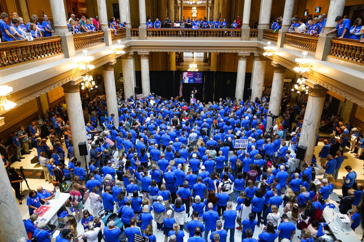 FILE - Anti-abortion supporters rally as the Indiana Senate Rules Committee met to consider a Republican proposal to ban nearly all abortions in the state during a hearing at the Statehouse in Indianapolis, July 26, 2022. The debate over a limited set of circumstances in which abortion could be legal is causing divisions among GOP lawmakers in some states.