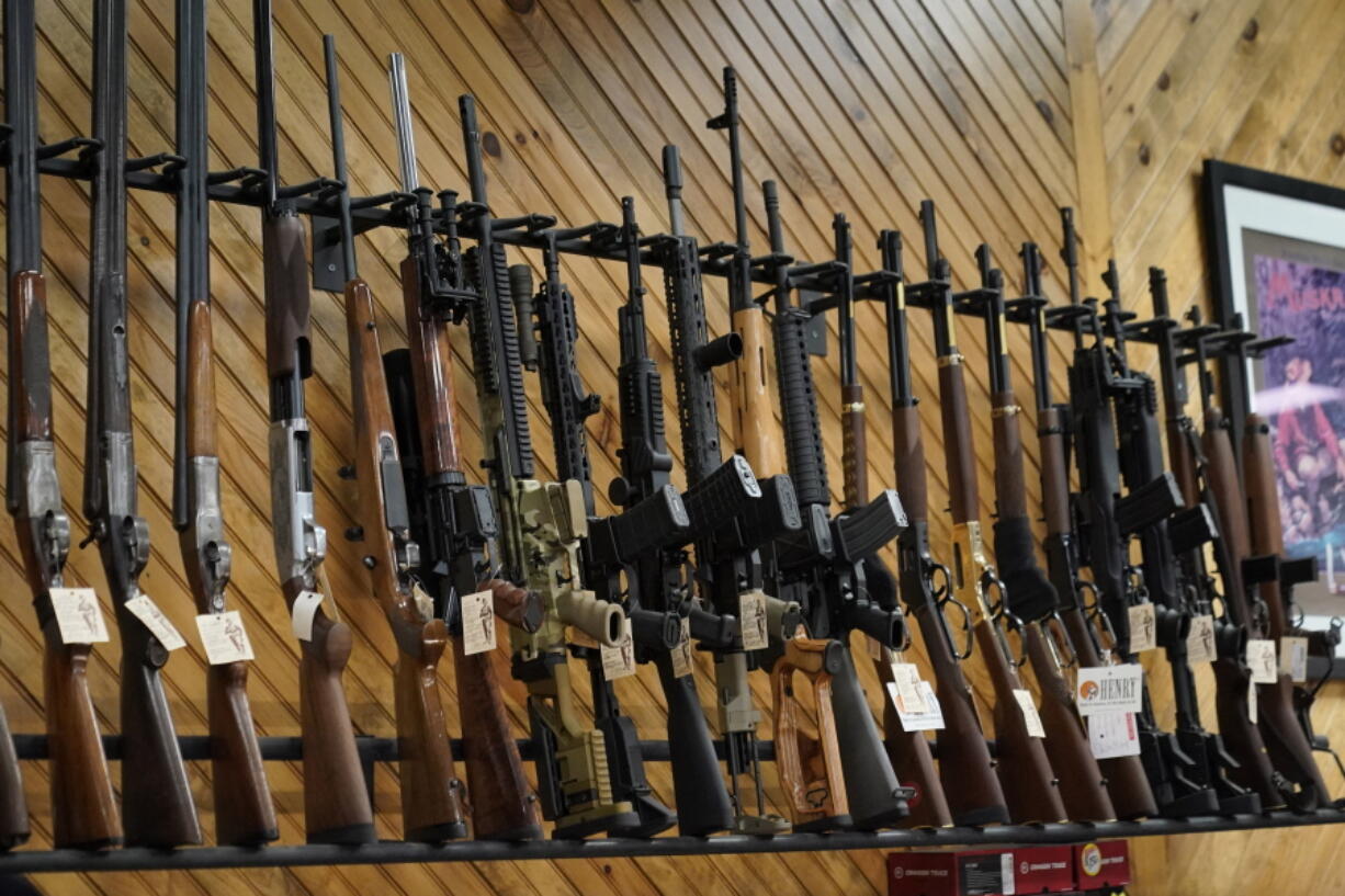 Various guns are displayed at a store on July 18, 2022, in Auburn, Maine. Most U.S. adults think gun violence is increasing nationwide and want to see gun laws made stricter. That's according to a new poll that finds broad public support for a variety of gun restrictions. The poll comes from the University of Chicago Harris School of Public Policy and The Associated Press-NORC Center for Public Affairs Research. (AP Photo/Robert F.