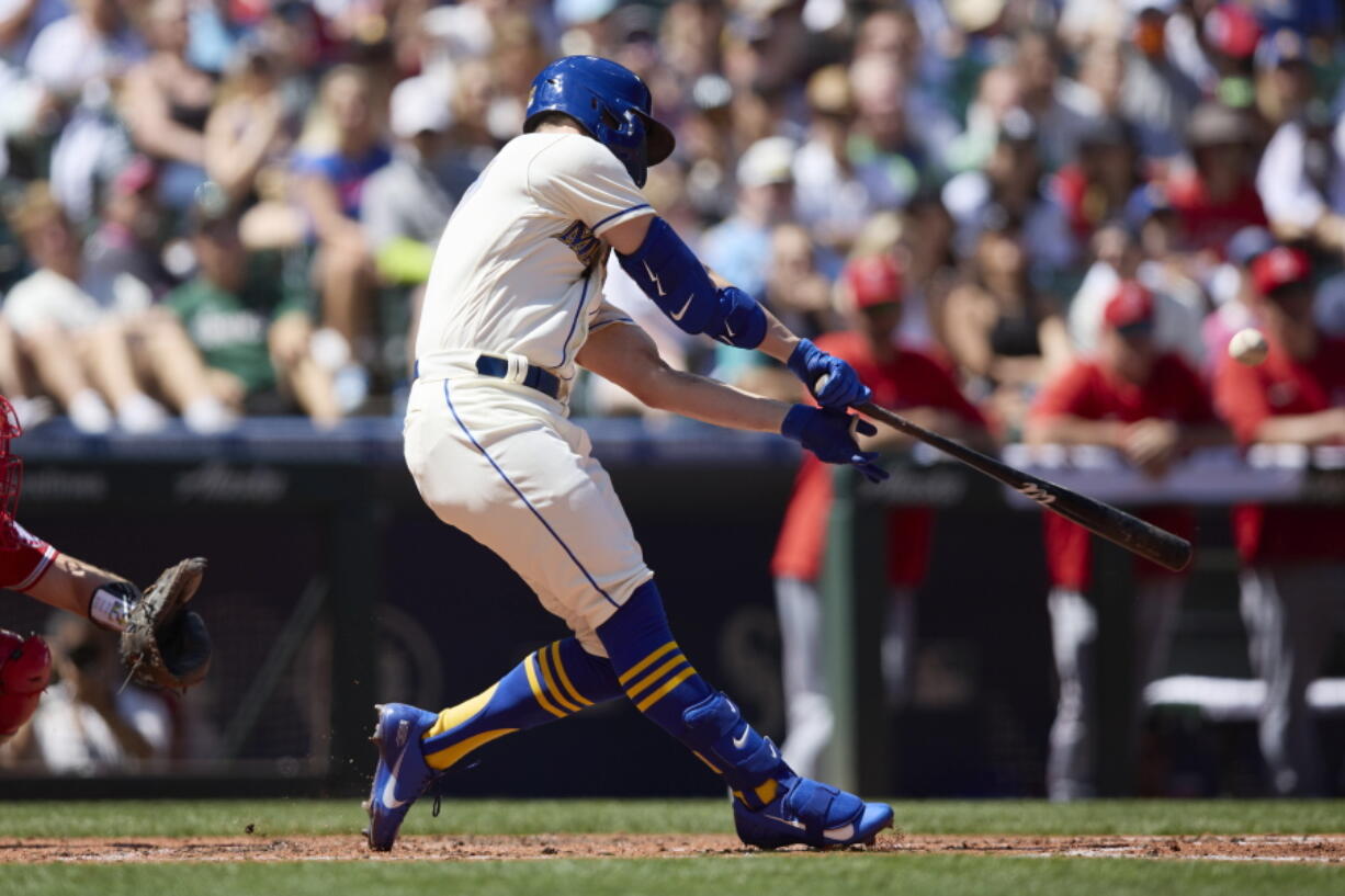 Seattle Mariners' Jesse Winker hits a grand slam against the Los Angeles Angels on a pitch from Tucker Davidson during third inning of a baseball game, Sunday, Aug. 7, 2022, in Seattle.