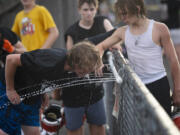 Battle Ground football players take a water break on the first day of football practice on Wednesday, Aug. 17, 2022.