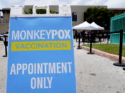 FILE -  A sign for monkeypox vaccinations is shown at a vaccination site, Wednesday, Aug. 10, 2022, in Miami Beach, Fla. British health officials say the monkeypox outbreak across the country "shows signs of slowing" but that it's still too soon to know if the decline will be maintained. In a statement on Monday, Aug.