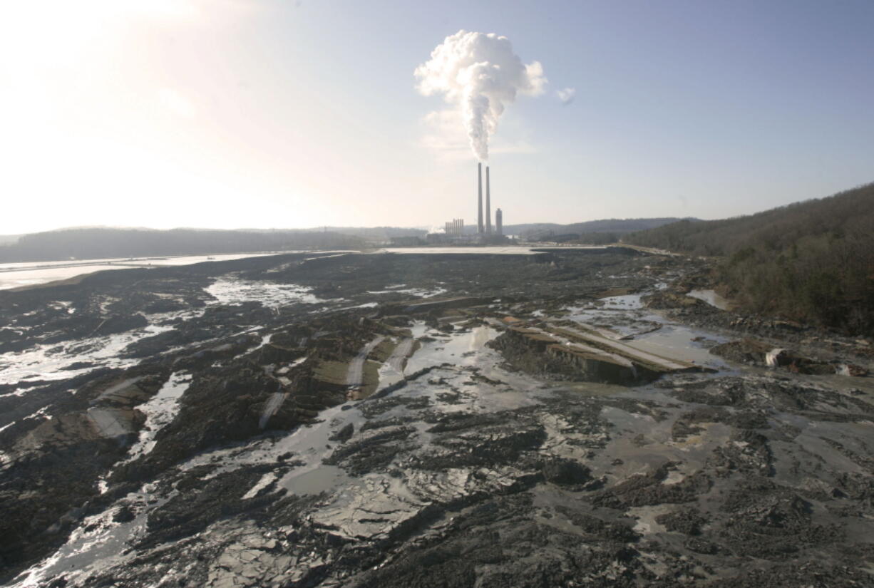 FILE - The aftermath of a retention pond wall collapse at the TVA Kingston Fossil Plant in Harriman, Tenn., is seen on Dec. 22, 2008. A coalition of environmental groups sued the Environmental Protection Agency on Thursday, Aug. 25, 2022, over its refusal to regulate some older coal ash dumps, claiming they are polluting air and groundwater.