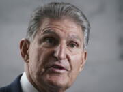 FILE - Sen. Joe Manchin, D-W.Va., speaks to reporters at the Capitol in Washington, Aug. 1, 2022. The sprawling economic package passed by the U.S. Senate this week has a certain West Virginia flavor. The bill, hammered out in negotiations between Manchin and Senate Majority Leader Chuck Schumer and passed with no Republican votes, could be read largely as an effort to help West Virginia look to the future without turning away entirely from its roots. (AP Photo/J.