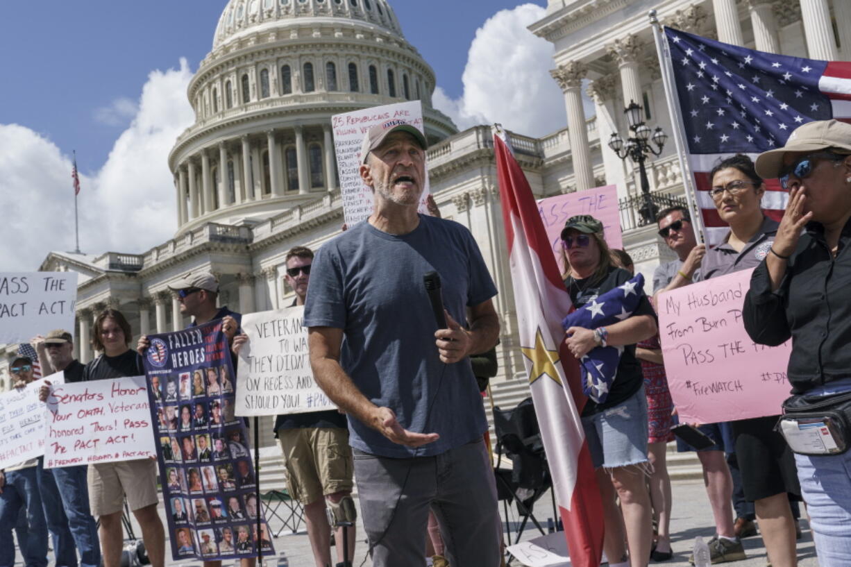 Veterans, military family members and advocates are joined by activist Jon Stewart as they call for Senate Republicans to change their votes on a bill designed to help millions of veterans exposed to toxic substances during their military service, at the Capitol in Washington, Monday, Aug. 1, 2021. A bill that enhances health care and disability benefits for millions of veterans exposed to toxic burn pits has hit a snag in the Senate. (AP Photo/J.