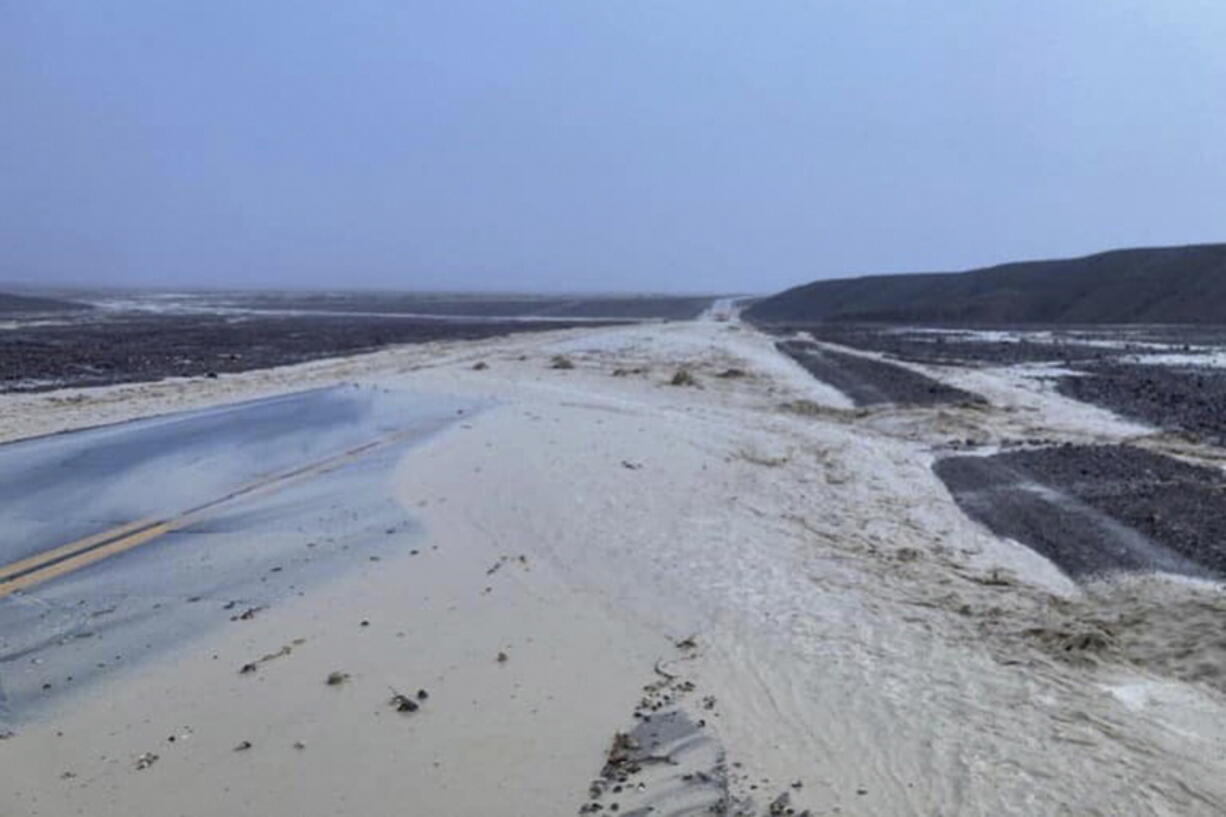 In this photo provided by the National Park Service, Highway 190 is closed due to flash flooding in Death Valley National Park, Calif., Friday, Aug. 5, 2022. Heavy rainfall triggered flash flooding that closed several roads in Death Valley National Park on Friday near the California-Nevada line. The National Weather Service reported that all park roads had been closed after 1 to 2 inches of rain fell in a short amount of time.