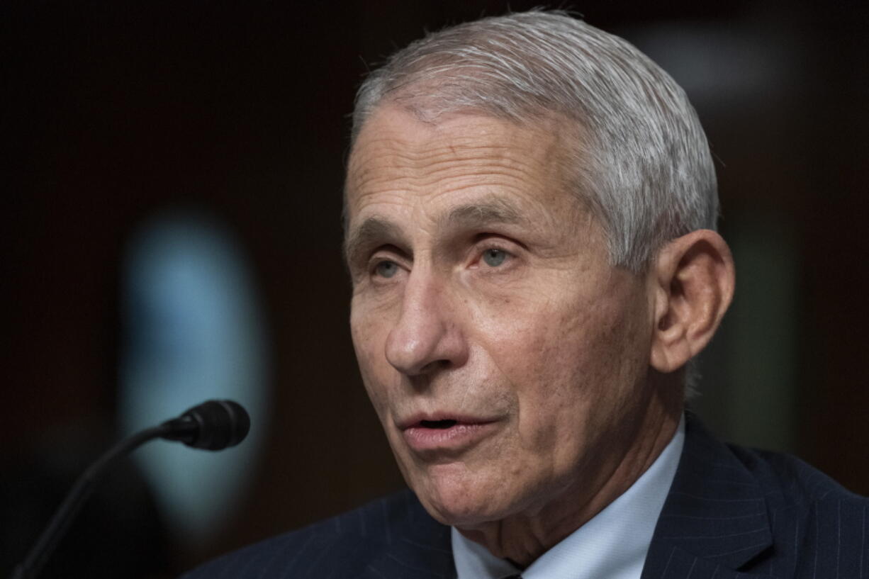 FILE - Dr. Anthony Fauci, director of the National Institute of Allergy and Infectious Diseases, speaks during a Senate Health, Education, Labor, and Pensions Committee hearing on Capitol Hill, Nov. 4, 2021, in Washington. Fauci, the nation's top infectious disease expert who became a household name, and the subject of partisan attacks, during the COVID-19 pandemic, announced Monday he will depart the federal government in December after more than 5 decades of service.