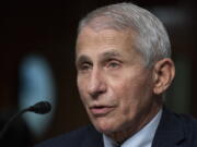 FILE - Dr. Anthony Fauci, director of the National Institute of Allergy and Infectious Diseases, speaks during a Senate Health, Education, Labor, and Pensions Committee hearing on Capitol Hill, Nov. 4, 2021, in Washington. Fauci, the nation's top infectious disease expert who became a household name, and the subject of partisan attacks, during the COVID-19 pandemic, announced Monday he will depart the federal government in December after more than 5 decades of service.