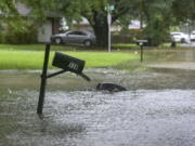 A mailbox stands in floodwaters from heavy rains that have plagued the region in recent days on Foxboro Drive in northeast Jackson, Miss., Wednesday, Aug. 24, 2022. Torrential rains and flash flooding prompted rescue operations, closures and evacuations in the central part of the state.