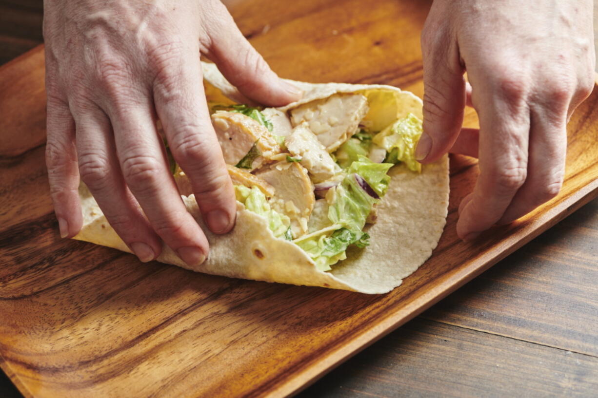 Assembling a chicken caesar wrap isn't hard to do -- just be sure not to overfill it.