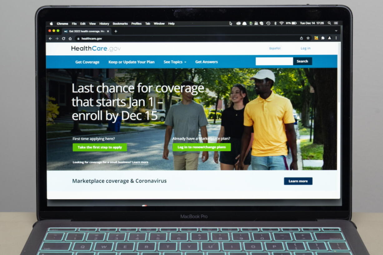 FILE - The healthcare.gov website is seen, on Dec. 14, 2021 in Fort Washington, Md. Millions of people in the United States will be spared from big increases in health care costs next year after President Joe Biden signed legislation extending generous subsidies for those who buy plans through federal and state marketplaces.