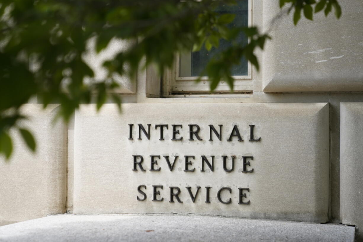 A sign outside the Internal Revenue Service building in Washington, on May 4, 2021. The Internal Revenue Service says it is conducting a comprehensive review of safety at its facilities. The action comes in response to an increasing number of threats borne of conspiracy theories that agents were going to aggressively target middle-income taxpayers.