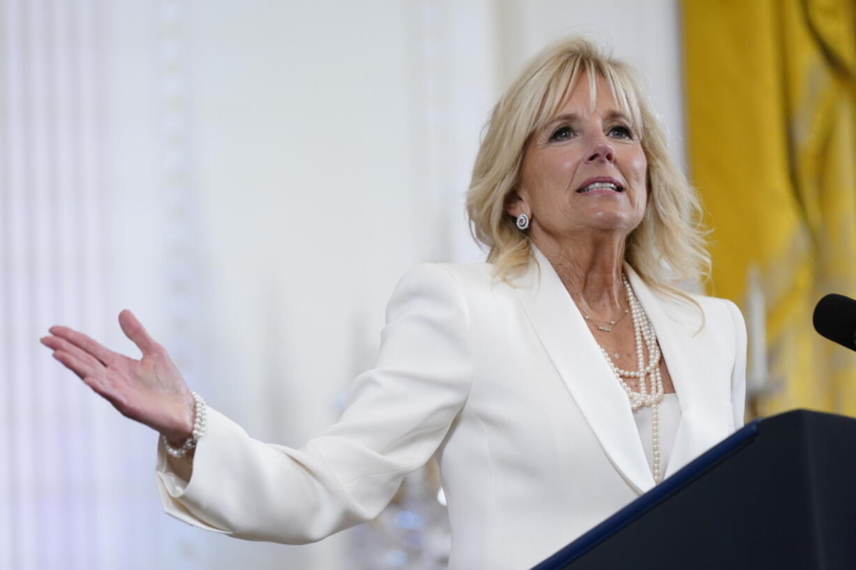 FILE - First lady Jill Biden speaks at an event in the East Room of the White House, June 15, 2022, in Washington. White House says the first lady has tested negative for COVID-19 and will return to the Washington, area on Tuesday, Aug. 30.