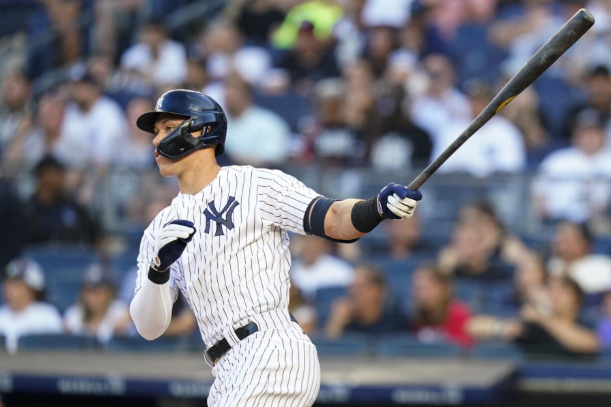 New York Yankees' Aaron Judge follows through on a double during the first inning of a baseball game against the Seattle Mariners, Monday, Aug. 1, 2022, in New York.