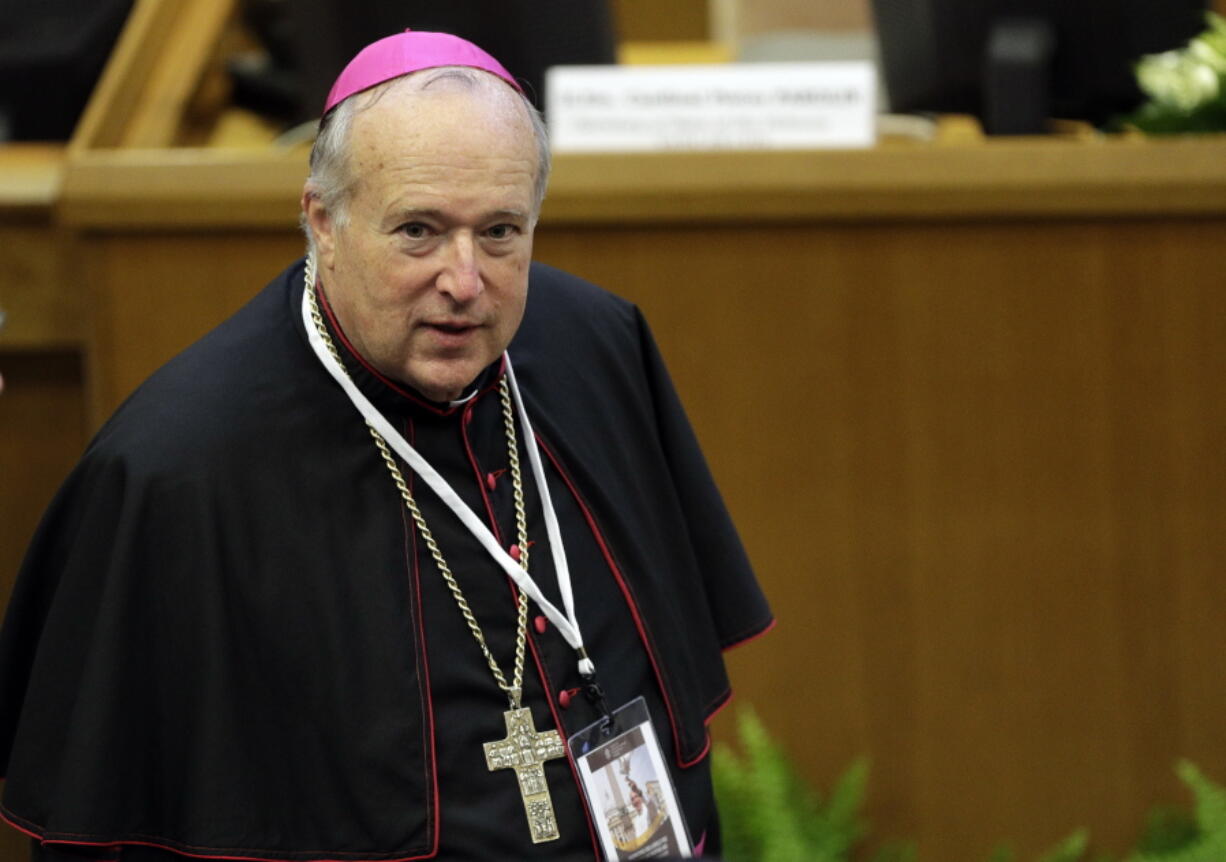 FILE - Robert W. McElroy, bishop of the diocese of San Diego, arrives to attend a conference on nuclear disarmament, at the Vatican, Friday, Nov. 10, 2017. When San Diego Bishop McElroy receives his prestigious red hat at the Vatican on Saturday, he will bring to the College of Cardinals a fervent loyalty to Pope Francis that has often put him at odds with the conservative majority in the U.S. Conference of Catholic Bishops.