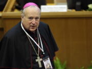 FILE - Robert W. McElroy, bishop of the diocese of San Diego, arrives to attend a conference on nuclear disarmament, at the Vatican, Friday, Nov. 10, 2017. When San Diego Bishop McElroy receives his prestigious red hat at the Vatican on Saturday, he will bring to the College of Cardinals a fervent loyalty to Pope Francis that has often put him at odds with the conservative majority in the U.S. Conference of Catholic Bishops.