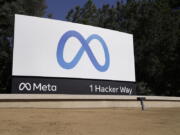 FILE - Facebook's Meta logo sign is seen at the company headquarters in Menlo Park, Calif., on, Oct. 28, 2021. Facebook owner Meta is quietly curtailing some of the safeguards designed to thwart voting misinformation or foreign interference in elections even as the U.S. Midterms approach.