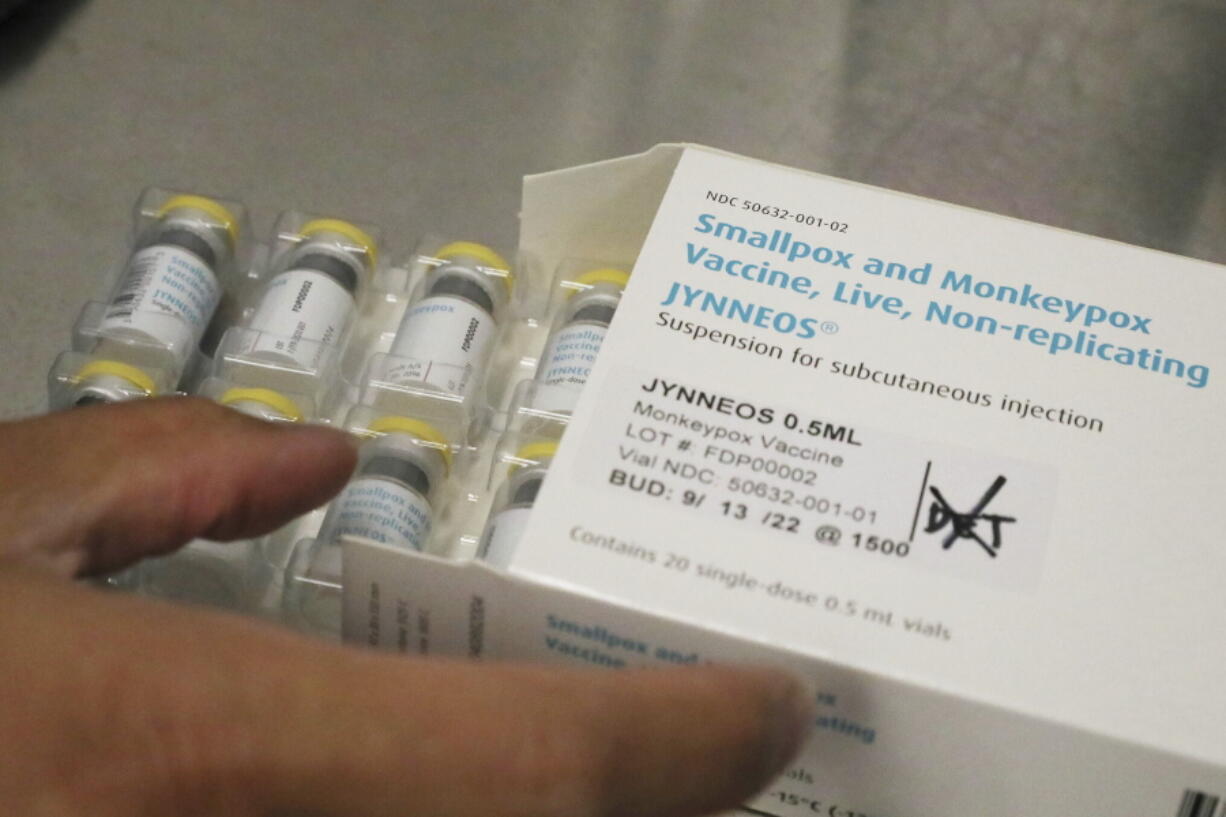 FILE - Jonathan Parducho, a pharmacist, removes a tray of vials of of the Jynneos vaccine for monkeypox from a box containing 20 doses, in the vaccine hub at Zuckerberg San Francisco General Hospital, July 29, 2022, in San Francisco. The U.S. will declare a public health emergency to bolster the federal response to the outbreak of monkeypox that already has infected more than 6,600 Americans. That's according to two people familiar with the matter said.