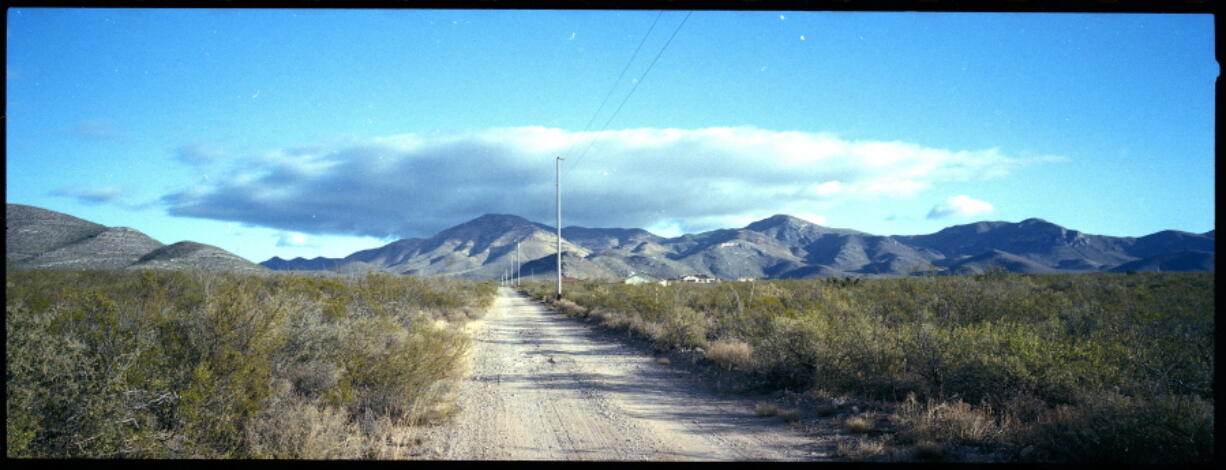 A dirt road leads to what was once the home of Paul Adams and his family on the outskirts of Bisbee, Ariz., Oct. 26, 2021. Adams, a Mormon and U.S. Border Patrol agent living with his wife and six children, admitted he had posted videos on the dark web of him molesting two of his children, a 9-year-old girl and a younger daughter he began raping when she was only 6 months old. Adams committed suicide after his arrest. The revelation that Mormon officials directed an effort to conceal years of abuse in the Adams household sparked a criminal investigation of the church by Cochise County attorney and a civil lawsuit by three of the Adams' children.