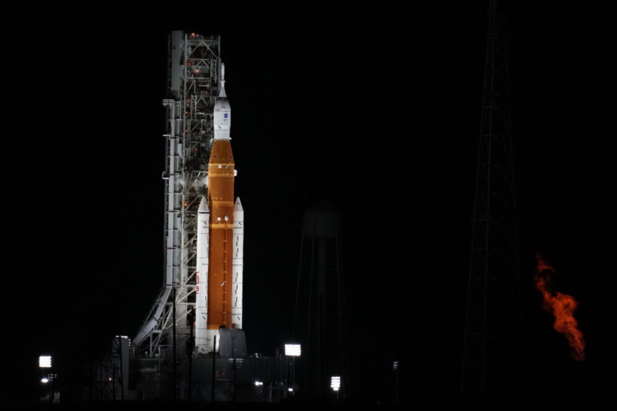 NASA's new moon rocket sits on Launch Pad 39-B hours before liftoff Monday, Aug. 29, 2022, in Cape Canaveral, Fla. This is scheduled to be the first flight of NASA's 21st-century moon-exploration program, named Artemis after Apollo's mythological twin sister.