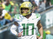 Oregon quarterback Bo Nix (10), who transferred from Auburn in time to participate in spring drills, is competing with redshirt freshmen Ty Thompson and Jay Butterfield for the Ducks starting job.