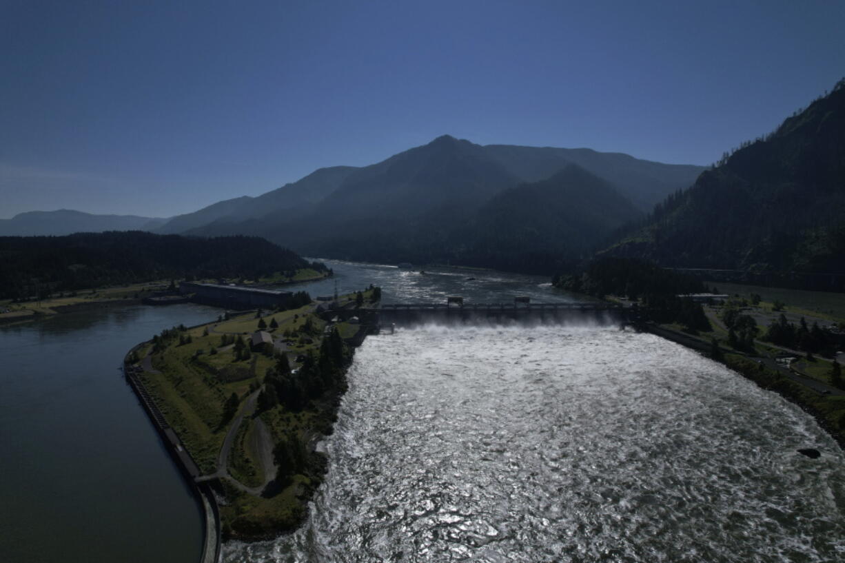 Water spills over the Bonneville Dam on the Columbia River, which runs along the Washington and Oregon state line, on Tuesday, June 21, 2022. Hydroelectric dams, like the Bonneville Dam, on the Columbia and its tributaries have curtailed the river's flow, further imperiling salmon migration from the Pacific Ocean to their freshwater spawning grounds upstream.