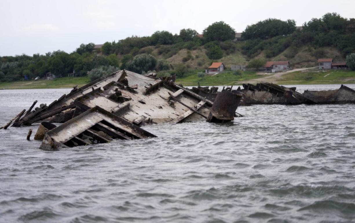 The wreckage of a WWII German warship is seen in the Danube river near Prahovo, Serbia, Monday, Aug. 29, 2022. The worst drought in Europe in decades has not only scorched farmland and hampered river traffic, it also has exposed a part of World War II history that had almost been forgotten. The hulks of dozens of German battleships have emerged from the mighty Danube River as its water levels dropped.